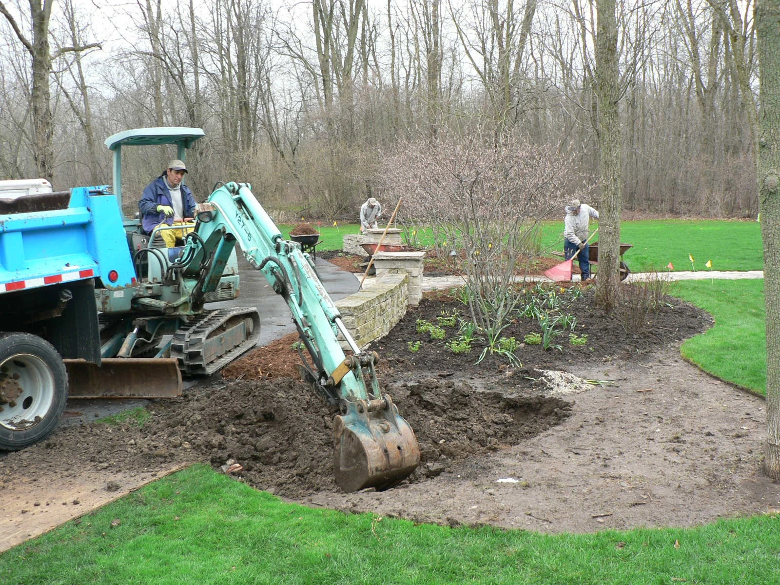 Digger creating space for a rain garden