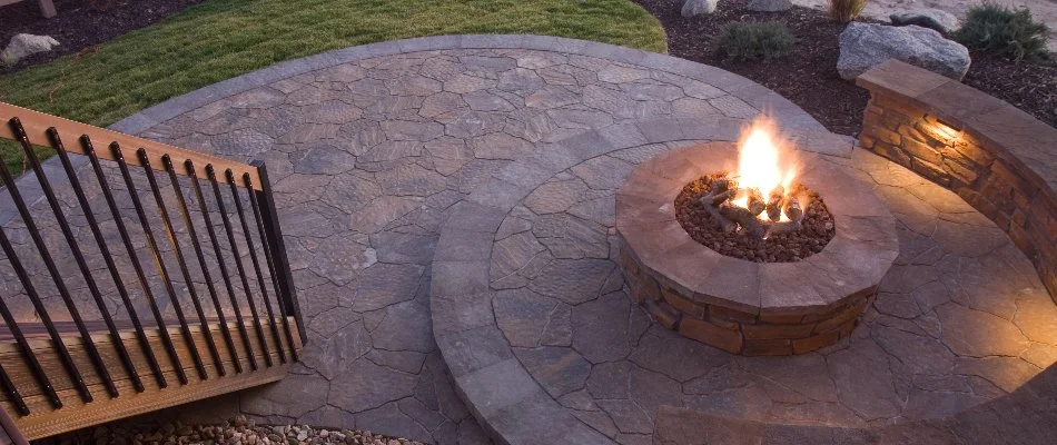 Burning fire pit on a raised patio next to stairs in %%targetcity1%%, WI.