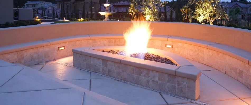 Burning fire pit surrounded by a seating wall in %%targetcity1%%, WI.