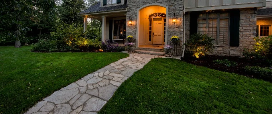 Flowers and shrubs along a paver walkway in Milwaukee, WI.