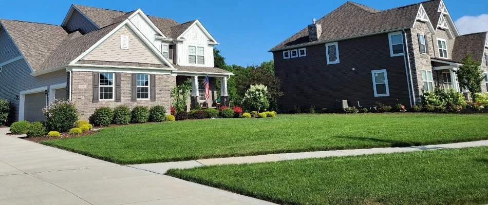 Lawn, landscape, and a walkway in a front yard in Elm Grove, WI.