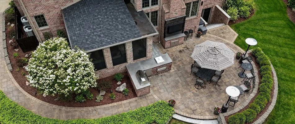 Patio area with a pergola and landscape plants in Fox Point, WI.