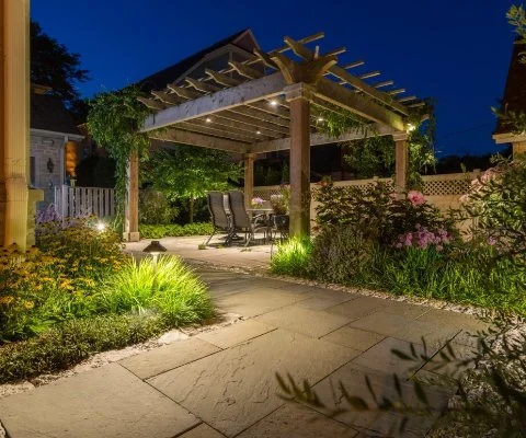 Pergola with plants and outdoor lighting in Wauwatosa, WI.