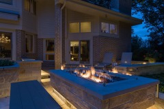 Wisconsin property with landscape lighting in patio