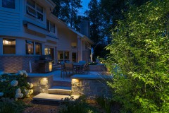 Wisconsin property with landscape lighting by stairs