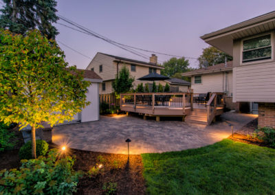 Brick patio and wooden decked area