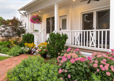 front porch with flowers and landscaping