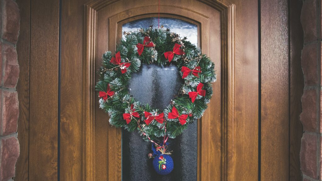 Seasonal Outdoor Decor: Christmas wreath hanging on door 